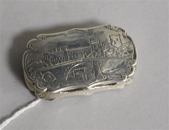 A Victorian silver vinaigrette, engraved with Windsor Castle?, Nathaniel Mills, Birmingham 1847, 48mm.